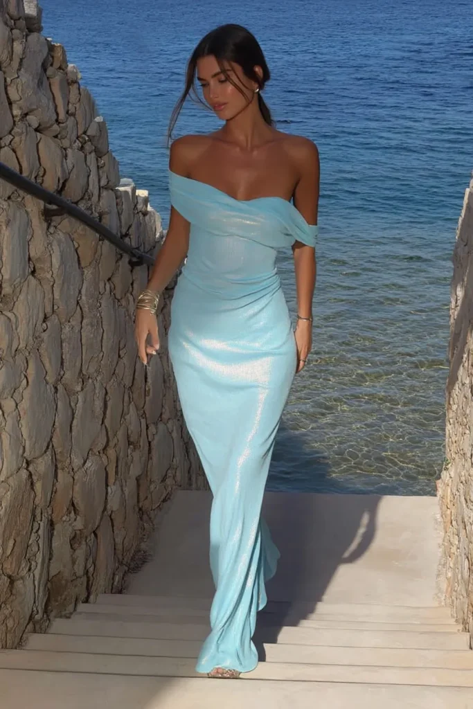 Elegant pastel blue sequin shimmer strapless fitted dress with delicate necklace ideal for glamorous cute vacation outfits styling at seaside resort destination