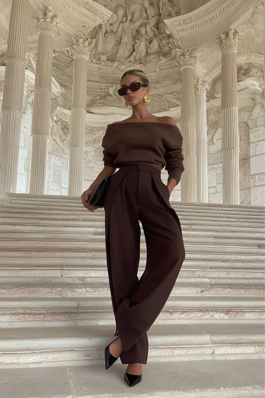 Chic outfits fall, warm brown coordinated set with cozy turtleneck sweater and wide-leg pants, gold accessories including sunglasses and clutch for refined autumn professional wear