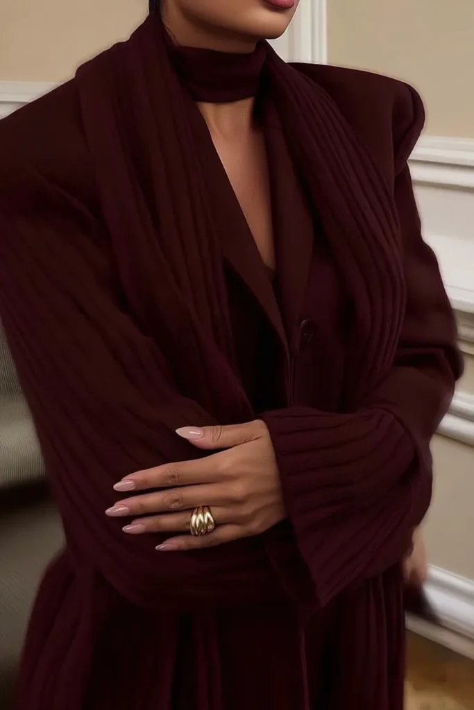 Cozy comfy winter outfits deep burgundy oversized blazer with matching turtleneck and midi skirt for relaxed elegant layering. Monochromatic cold weather outfit.