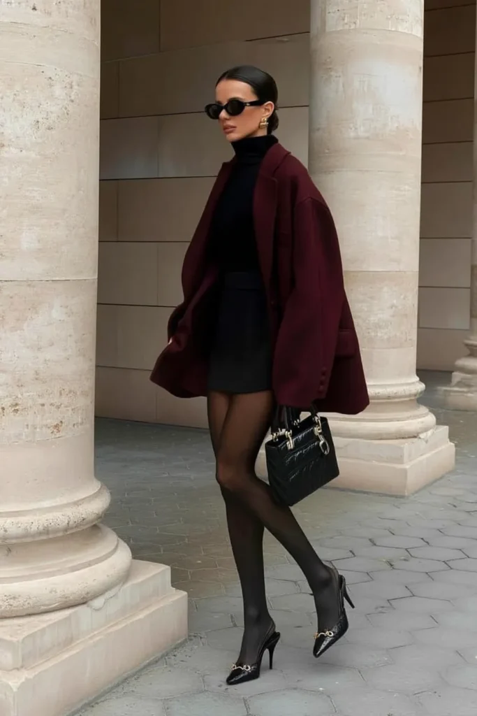Sophisticated winter outfits aesthetic, burgundy coat with patent leather accessories, effortlessly stylish cold weather ensembles with timeless appeal