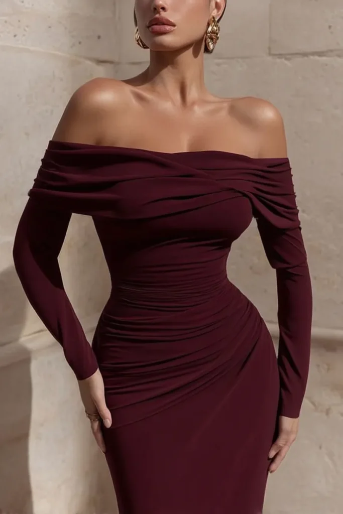 Elegant Christmas party outfit, burgundy off-shoulder bodycon dress and long sleeves, with statement gold earrings. This sophisticated outfit creates perfect festive evening glamour.